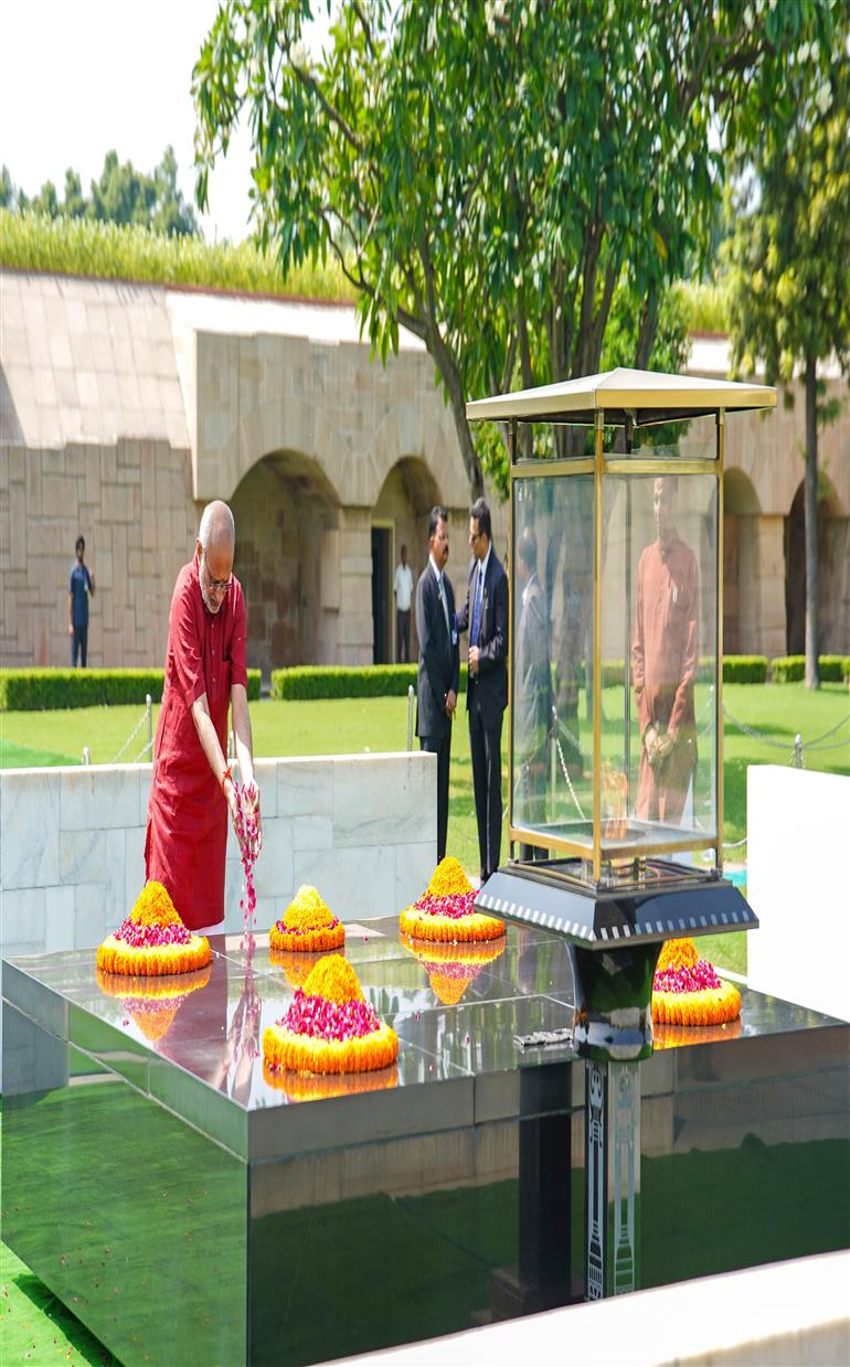 The Vice-President of India Shri C. P. Radhakrishnan pays floral tribute to Mahatma Gandhi at Rajghat, in Delhi on September 12, 2025.
