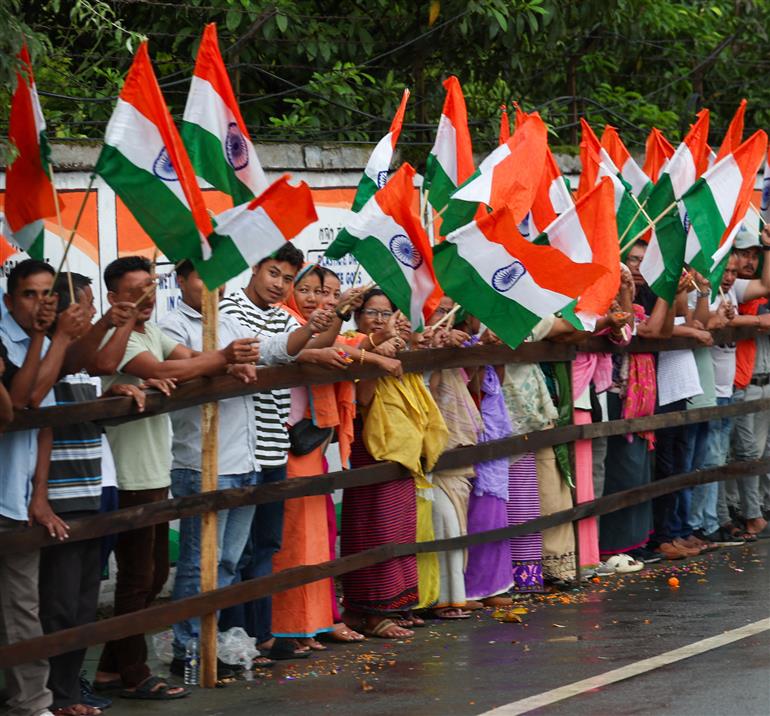 PM receives warm welcome by enthusiastic crowd during the Grand Road Show on his arrival at Imphal, in Manipur on September 13, 2025.