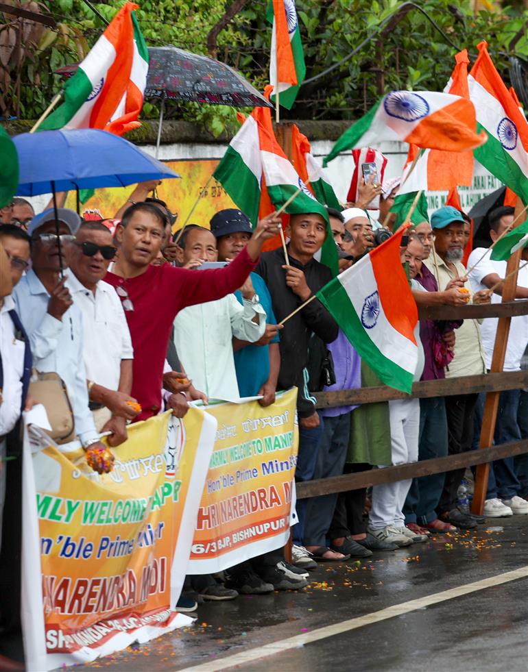 PM receives warm welcome by enthusiastic crowd during the Grand Road Show on his arrival at Imphal, in Manipur on September 13, 2025.
