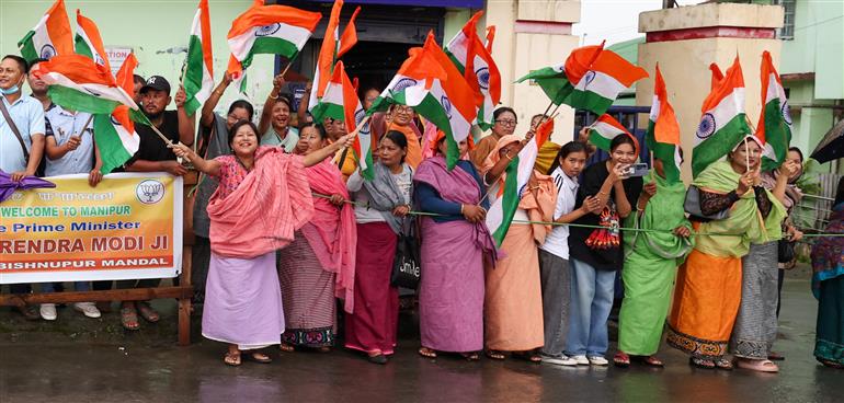 PM receives warm welcome by enthusiastic crowd during the Grand Road Show on his arrival at Imphal, in Manipur on September 13, 2025.