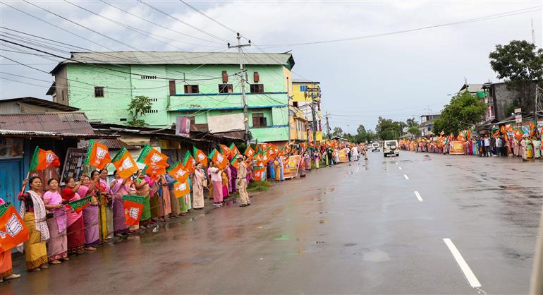 PM receives warm welcome by enthusiastic crowd during the Grand Road Show on his arrival at Imphal, in Manipur on September 13, 2025.