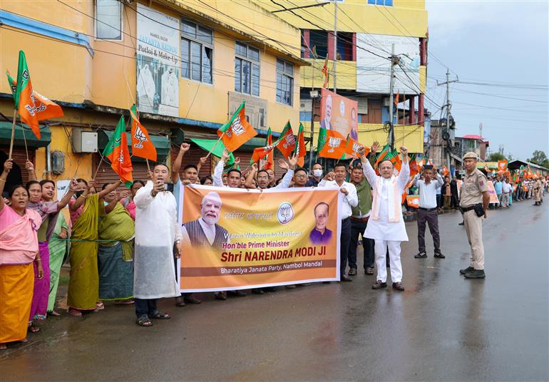PM receives warm welcome by enthusiastic crowd during the Grand Road Show on his arrival at Imphal, in Manipur on September 13, 2025.