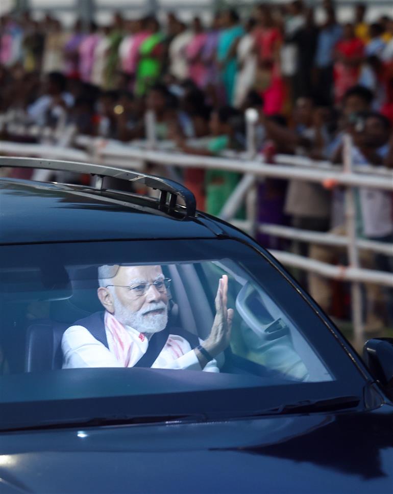 PM receives warm welcome by enthusiastic crowd during the Grand Road Show on his arrival at Guwahati, in Assam on September 13, 2025.