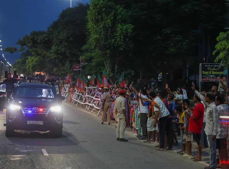 PM receives warm welcome by enthusiastic crowd during the Grand Road Show on his arrival at Guwahati, in Assam on September 13, 2025.