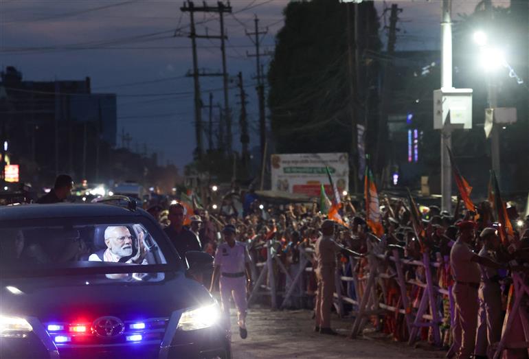 PM receives warm welcome by enthusiastic crowd during the Grand Road Show on his arrival at Guwahati, in Assam on September 13, 2025.