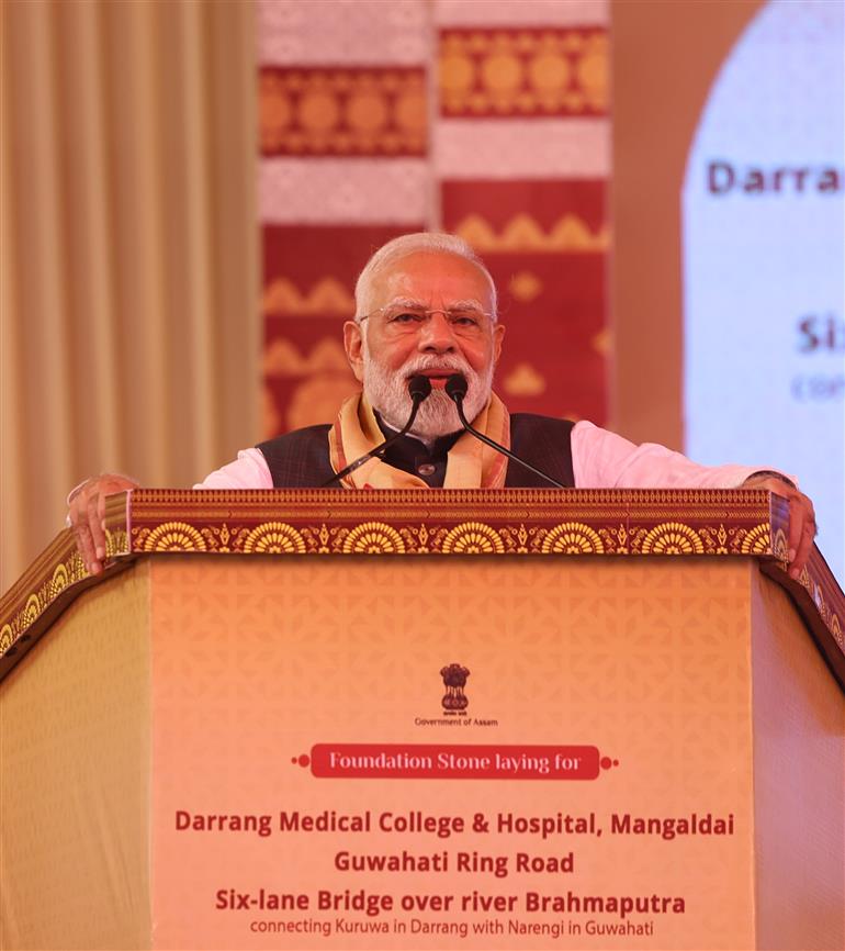 PM addressing the gathering at the inauguration and laying the foundation stone of multiple development projects at Darrang, in Assam on September 14, 2025.