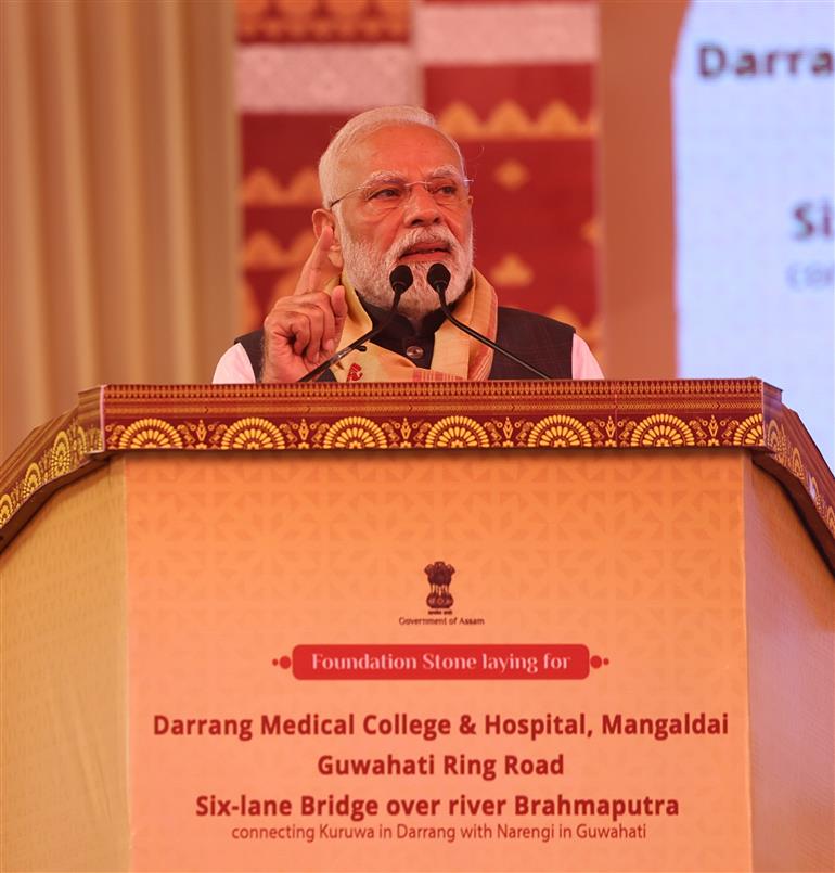 PM addressing the gathering at the inauguration and laying the foundation stone of multiple development projects at Darrang, in Assam on September 14, 2025.