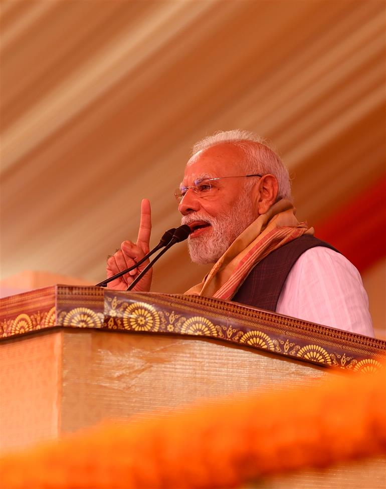 PM addressing the gathering at the inauguration and laying the foundation stone of multiple development projects at Darrang, in Assam on September 14, 2025.