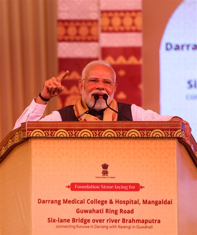 PM addressing the gathering at the inauguration and laying the foundation stone of multiple development projects at Darrang, in Assam on September 14, 2025.