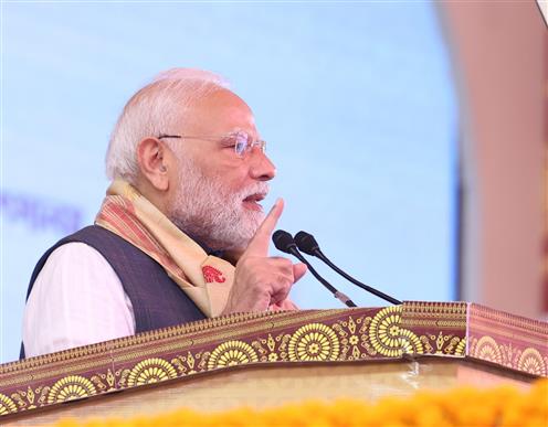 PM addressing the gathering at the inauguration and laying the foundation stone of multiple development projects at Darrang, in Assam on September 14, 2025.