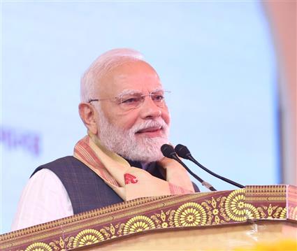 PM addressing the gathering at the inauguration and laying the foundation stone of multiple development projects at Darrang, in Assam on September 14, 2025.