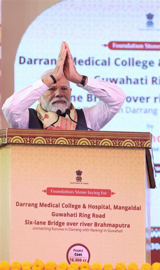 PM addressing the gathering at the inauguration and laying the foundation stone of multiple development projects at Darrang, in Assam on September 14, 2025.