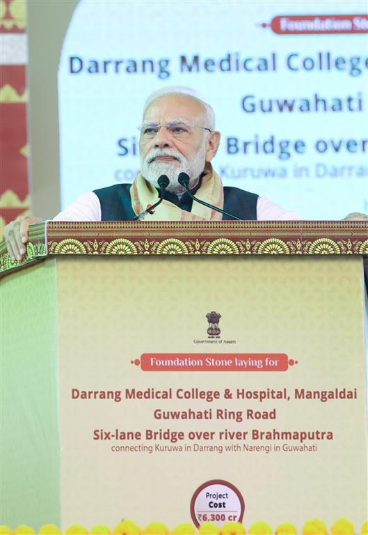 PM addressing the gathering at the inauguration and laying the foundation stone of multiple development projects at Darrang, in Assam on September 14, 2025.