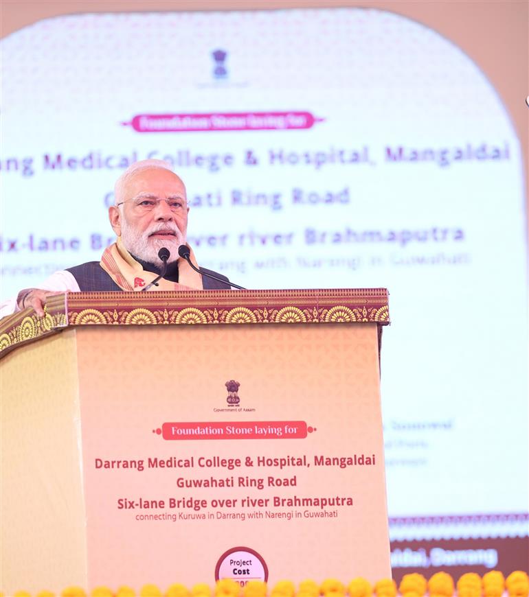 PM addressing the gathering at the inauguration and laying the foundation stone of multiple development projects at Darrang, in Assam on September 14, 2025.