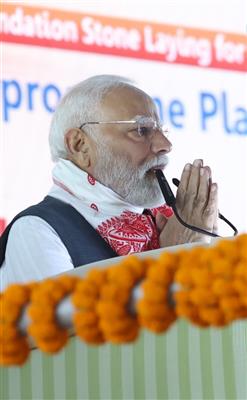 PM addressing the gathering at the laying of foundation Stone of Polypropylene Plant at Golaghat, in Assam on September 14, 2025.