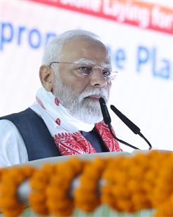 PM addressing the gathering at the laying of foundation Stone of Polypropylene Plant at Golaghat, in Assam on September 14, 2025.