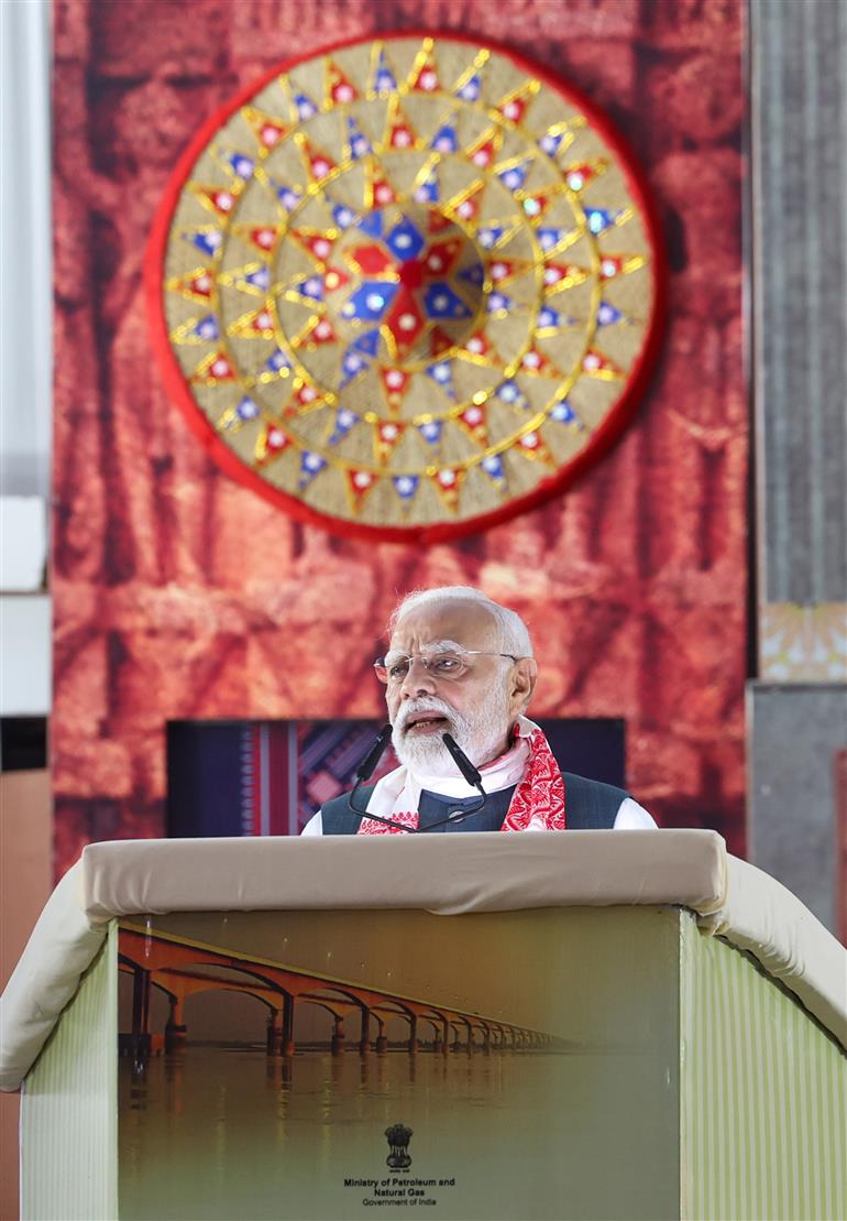 PM addressing the gathering at the laying of foundation Stone of Polypropylene Plant at Golaghat, in Assam on September 14, 2025.