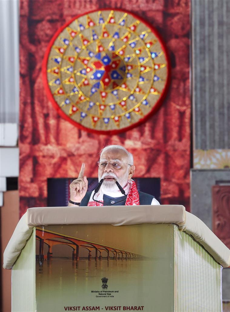 PM addressing the gathering at the laying of foundation Stone of Polypropylene Plant at Golaghat, in Assam on September 14, 2025.