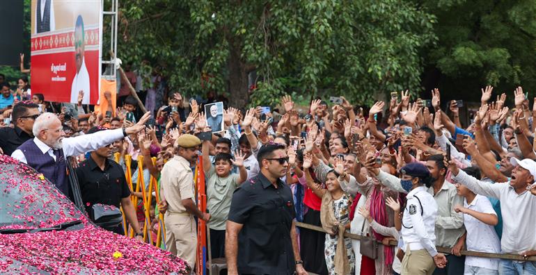 PM receives warm welcome by enthusiastic crowd during the Grand Road Show on his arrival at Bhavnagar, in Gujarat on September 20, 2025.