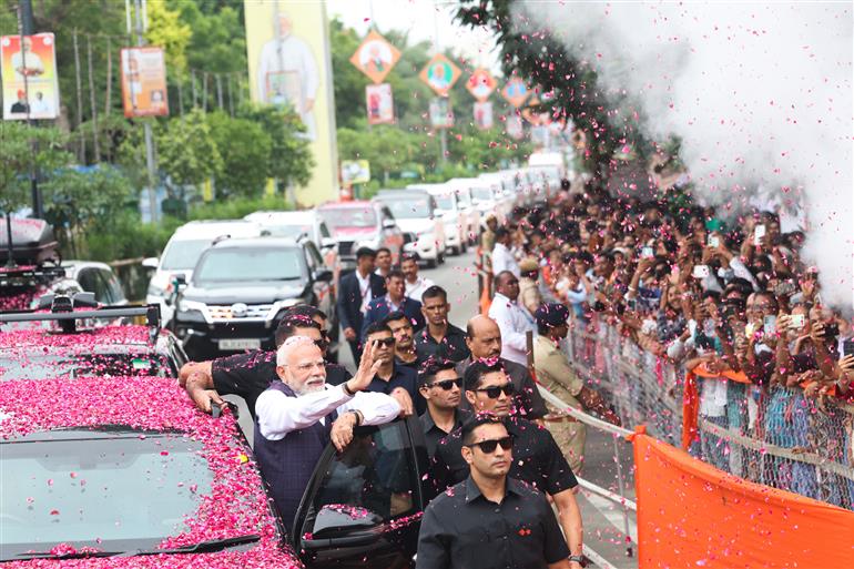 PM receives warm welcome by enthusiastic crowd during the Grand Road Show on his arrival at Bhavnagar, in Gujarat on September 20, 2025.