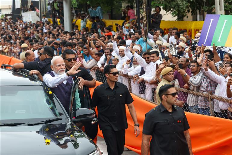PM receives warm welcome by enthusiastic crowd during the Grand Road Show on his arrival at Bhavnagar, in Gujarat on September 20, 2025.