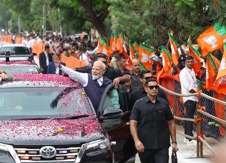 PM receives warm welcome by enthusiastic crowd during the Grand Road Show on his arrival at Bhavnagar, in Gujarat on September 20, 2025.