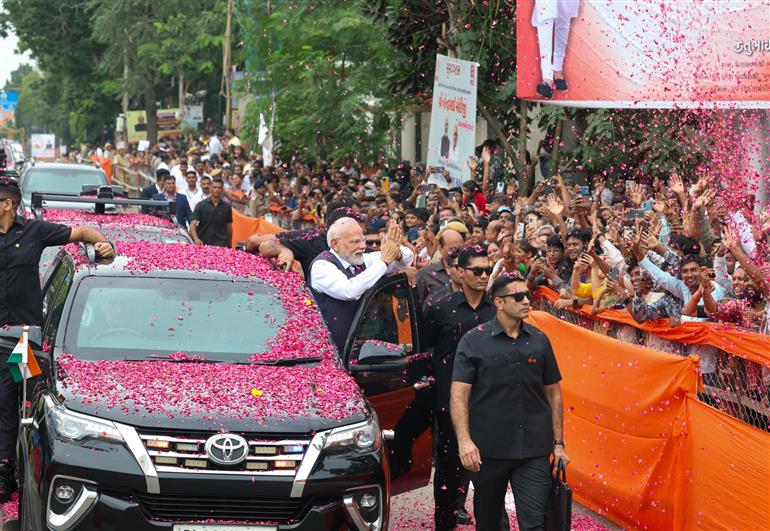 PM receives warm welcome by enthusiastic crowd during the Grand Road Show on his arrival at Bhavnagar, in Gujarat on September 20, 2025.
