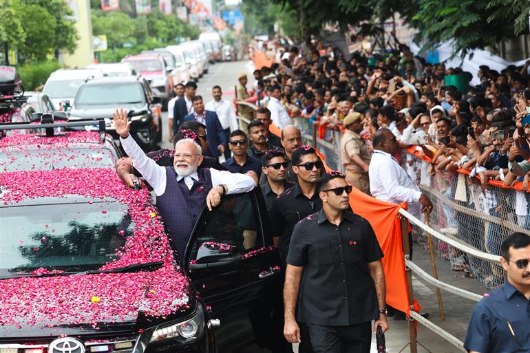 PM receives warm welcome by enthusiastic crowd during the Grand Road Show on his arrival at Bhavnagar, in Gujarat on September 20, 2025.