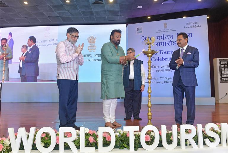 The Minister of State for Petroleum and Natural Gas & Tourism, Shri Suresh Gopi lighting the lamp during the World Tourism Day celebrations organized by the Ministry of Tourism at Sushma Swaraj Bhawan, in New Delhi on September 27, 2025. 
