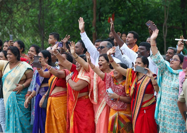 PM receives warm welcome by people during the Grand Road Show on his arrival at Jharsuguda, in Odisha on September 27, 2025.