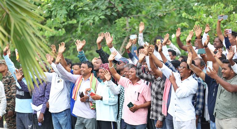 PM receives warm welcome by people during the Grand Road Show on his arrival at Jharsuguda, in Odisha on September 27, 2025.