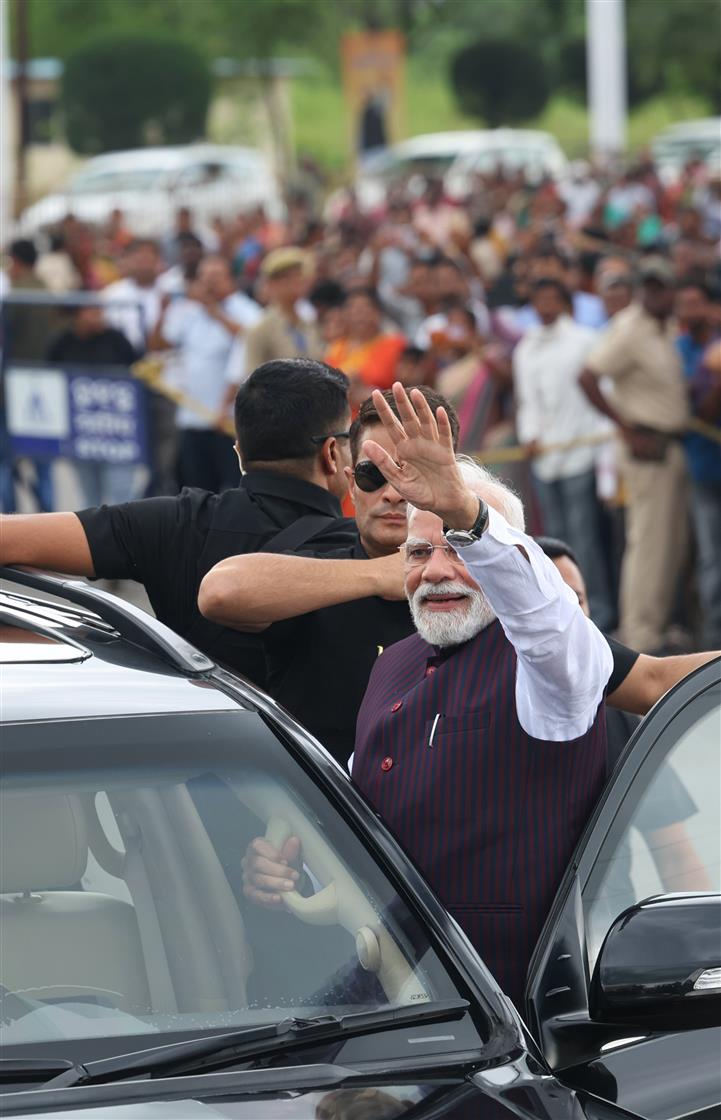 PM receives warm welcome by people during the Grand Road Show on his arrival at Jharsuguda, in Odisha on September 27, 2025.