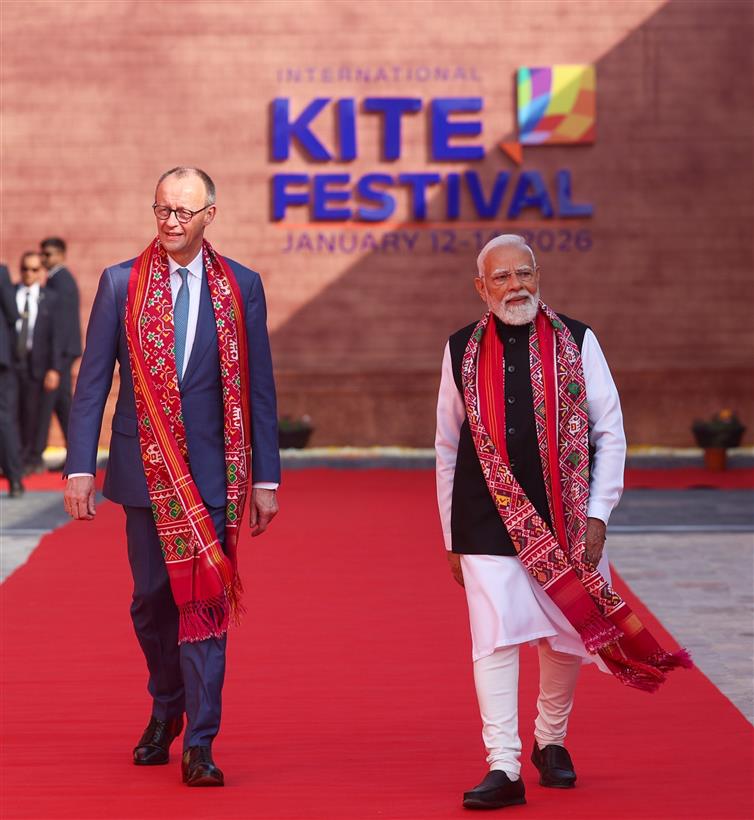 PM and German Chancellor Friedrich Merz, participates in the International Kite Festival at the Sabarmati Riverfront at Ahmedabad, in Gujarat on January 12, 2026.