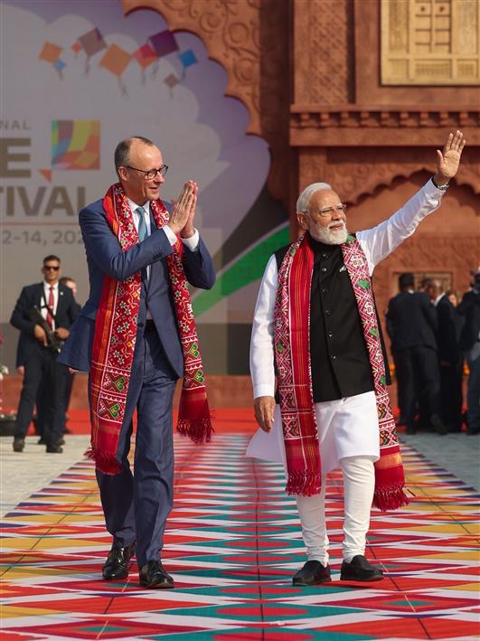 PM and German Chancellor Friedrich Merz, participates in the International Kite Festival at the Sabarmati Riverfront at Ahmedabad, in Gujarat on January 12, 2026.