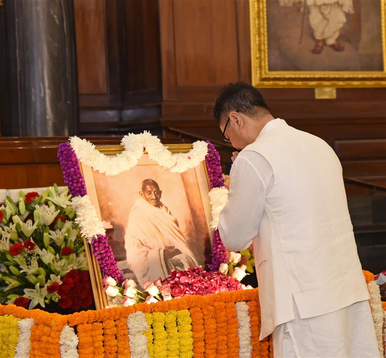 The Union Minister of Minority Affairs and Parliamentary Affairs, Shri Kiren Rijiju paying homage to Mahatma Gandhi on the occasion of Gandhi Jayanti at Parliament House, in New Delhi on October 02, 2026.