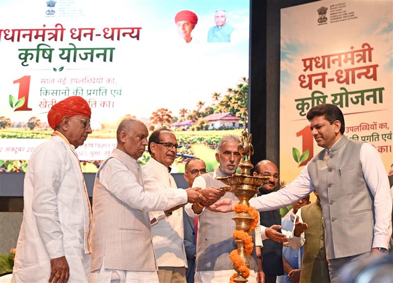 The Union Minister for Agriculture & Farmers Welfare and Rural Development, Shri Shivraj Singh Chouhan lighting the lamp in the program on the completion of 1 year of the PM Dhan-Dhaanya Krishi Yojana, in New Delhi on October 12, 2026. The Minister of State for Agriculture and Farmers Welfare, Shri Bhagirath Choudhary and other dignitaries present on the occasion.