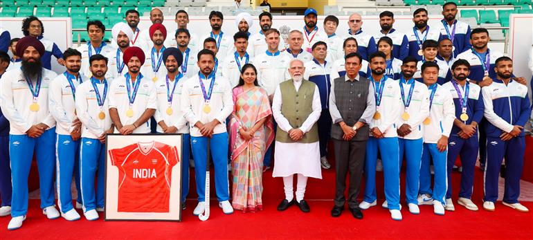 PM in a group photograph with the Indian Contingent for Asian Games 2026, in New Delhi on October 15, 2026.