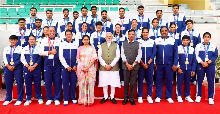 PM in a group photograph with the Indian Contingent for Asian Games 2026, in New Delhi on October 15, 2026.