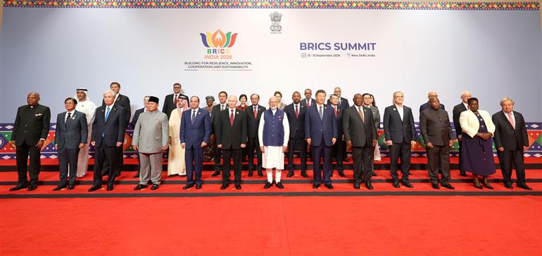 PM in a family photo with leaders of BRICS Member/Partner Countries Outreach Invitees and Heads of International Organisations at the 18th BRICS Summit, in Bharat Mandapam, New Delhi on September 13, 2026.