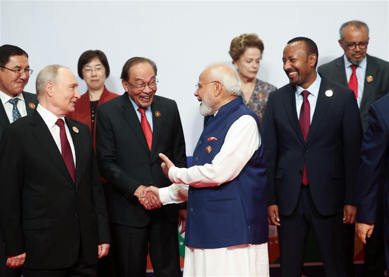 PM in a family photo with leaders of BRICS Member/Partner Countries Outreach Invitees and Heads of International Organisations at the 18th BRICS Summit, in Bharat Mandapam, New Delhi on September 13, 2026.