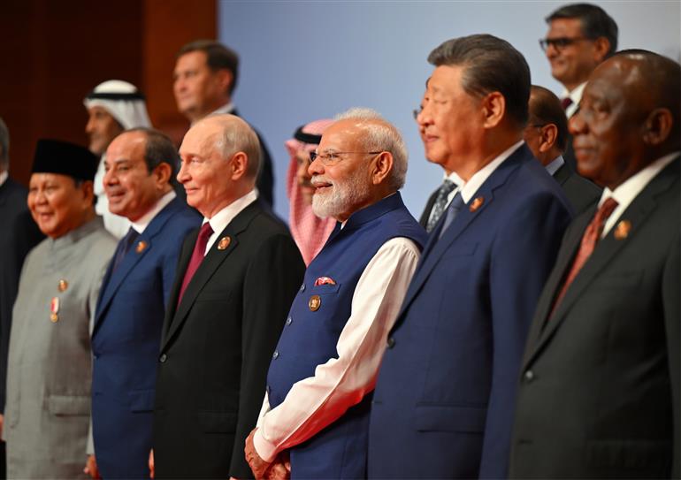 PM in a family photo with leaders of BRICS Member/Partner Countries Outreach Invitees and Heads of International Organisations at the 18th BRICS Summit, in Bharat Mandapam, New Delhi on September 13, 2026.