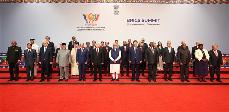 PM in a family photo with leaders of BRICS Member/Partner Countries Outreach Invitees and Heads of International Organisations at the 18th BRICS Summit, in Bharat Mandapam, New Delhi on September 13, 2026.
