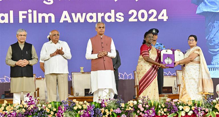 The President of India, Smt Droupadi Murmu confers the award for "Best Assamese Film (Juiphool)" "Producer: Shri Jadumoni Dutta, Ms. Rita Dutta &amp; Ms. Nandini Sharma Dutta Rep: Ms. Rita Dutta"	 Rajat at the 72nd National Film Awards ceremony at Ekta Nagar (Kevadia), in Gujarat on September 22, 2026.