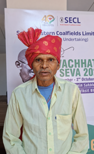 A person wearing a red turbanDescription automatically generated