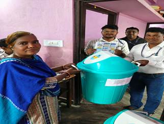 A group of people standing next to a blue trash canAI-generated content may be incorrect.