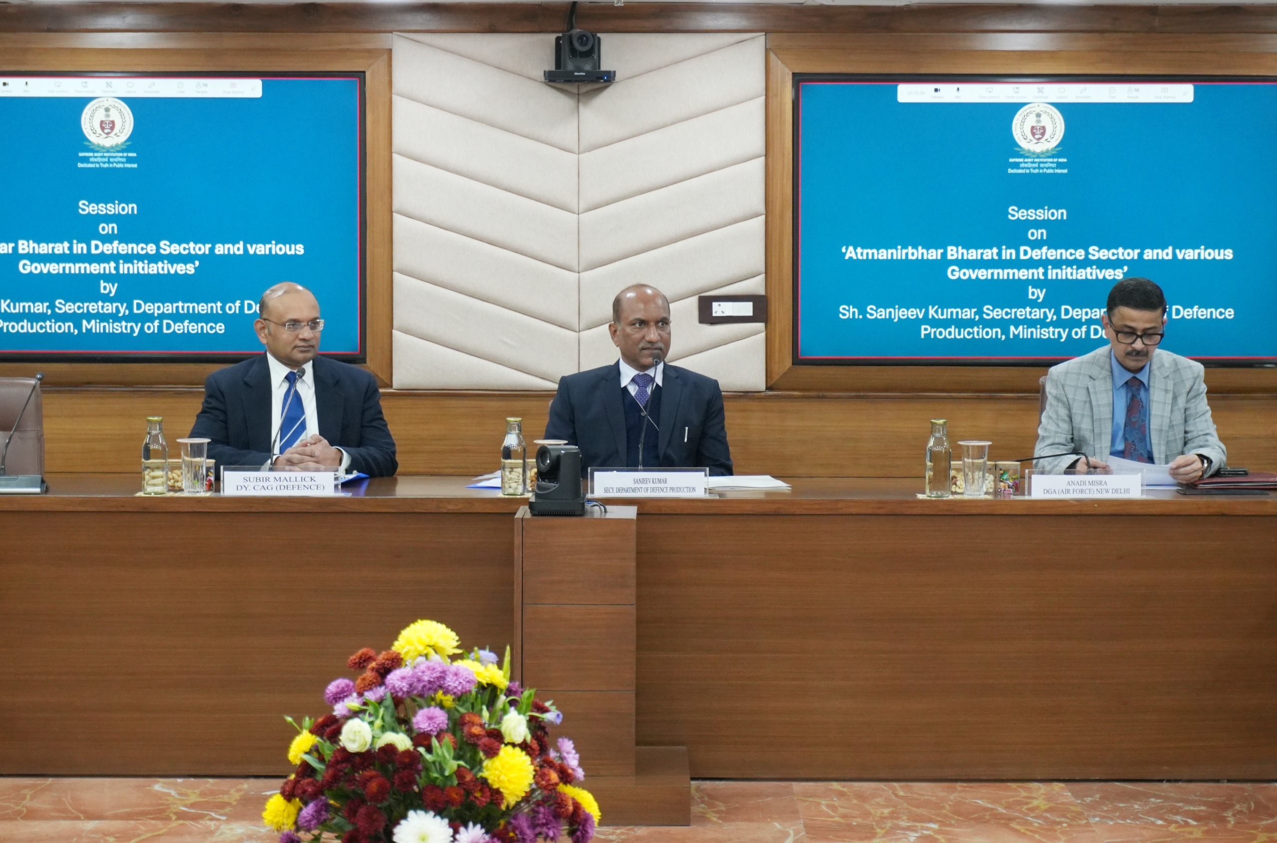 A group of men sitting at a tableDescription automatically generated