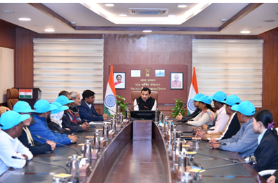 A group of people sitting around a tableAI-generated content may be incorrect.