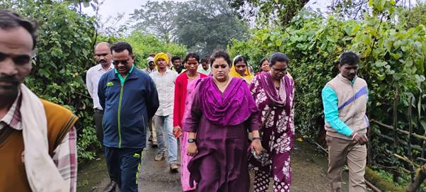 A group of people walking on a pathAI-generated content may be incorrect.
