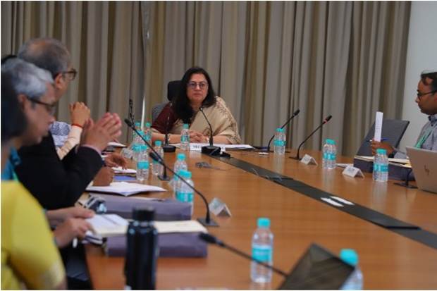 A group of people sitting at a tableAI-generated content may be incorrect.