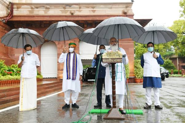 Holding umbrella by self, PM Modi addresses media in rain ahead of monsoon session of parliament